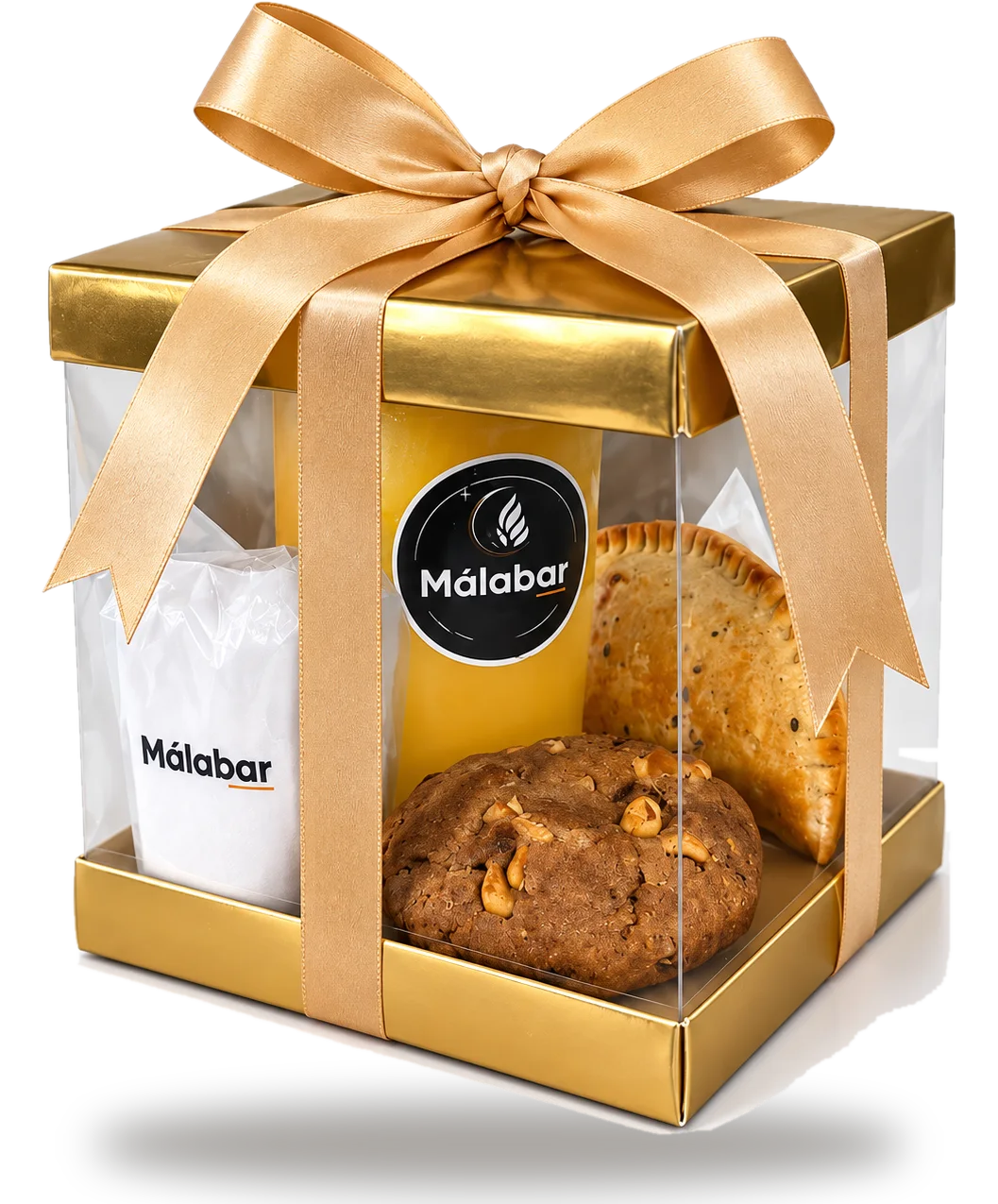 Caja de regalo Málabar con lazo dorado sobre el mostrador de la cafetería